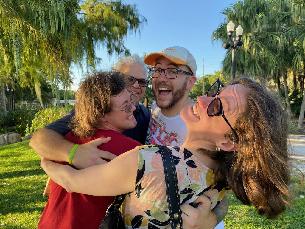 Members of SHJCF smiling and hugging at a park